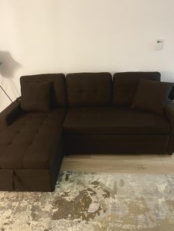 Sofa In brown color convertible