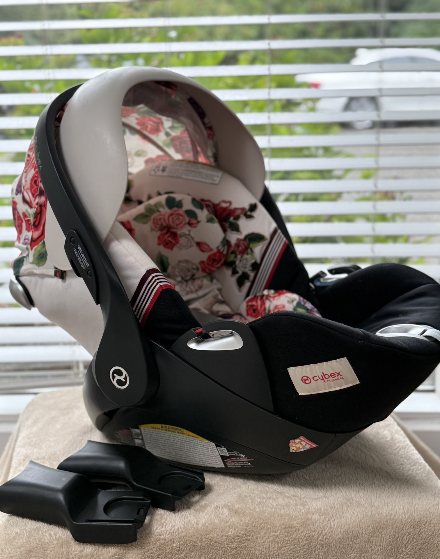 Cybex spring blossom cloud Q car seat with base and safe sensor.