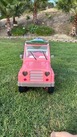 Pink Our Generation jeep w/ surfboard