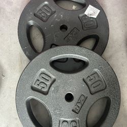 New pair of 50lb iron plates 1 inch hole