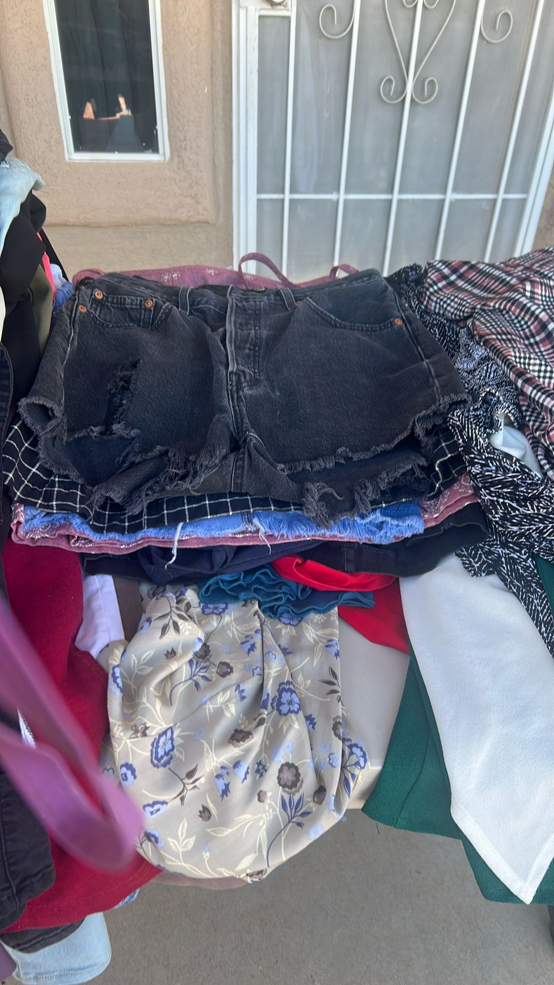 Jeans, Pants,skirts, shorts, blouses,dresses, T Shirts, Purses, Sunglasses Sandals, boots Everything For 60 dollars They Are In Good Condition