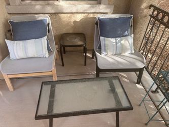 Outdoor patio chairs with side table and small coffee table