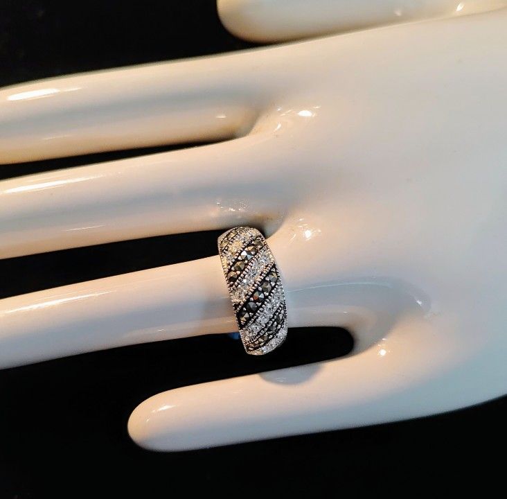 Marsala Sterling Silver Marcasite And CZ Band Ring
Size 8 Weighs Approximately 4.1 Grams And Reasonably Priced