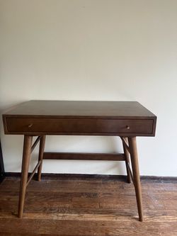 Small wooden desk with brass hardware