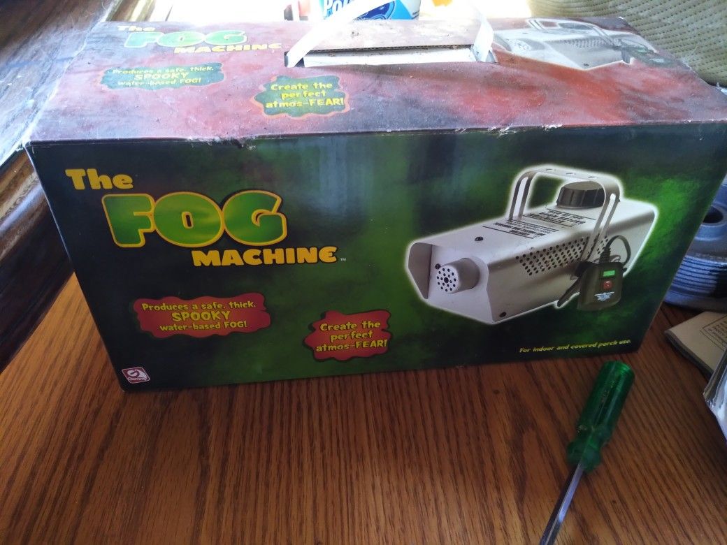 Brand new never used fog machine and 3 bottles fog solution