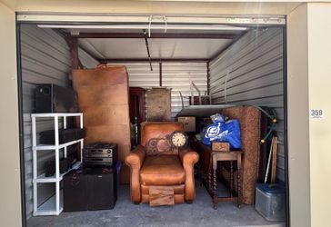 Auction Unit 359 6/26- Couch, Clocks, Stereo, Otterman, Table, Shelf Unit, Entertainment System, 