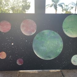 spray paint planet art on wood