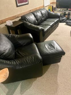 Leather couch and chair and glass table