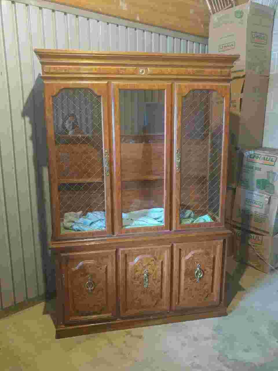 Formal Dining room set. China Hutch, Large table with a leave. Six chairs two captains plus table protector and several table cloths