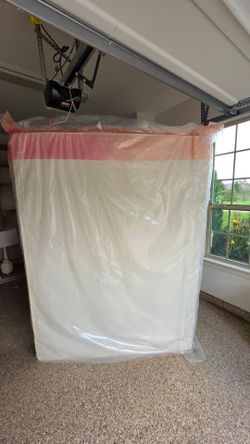 Queen size box spring still in plastic
