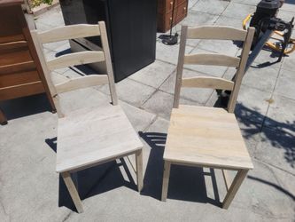 Two matching wood seaside style dining chairs