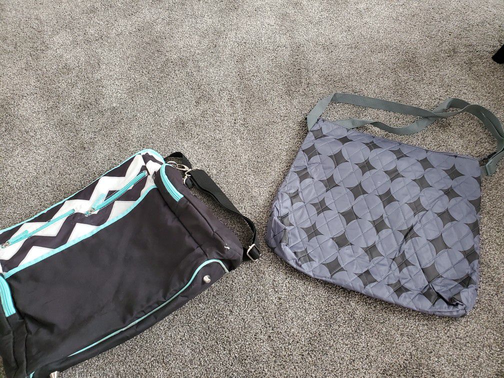 2 diaper bags. 1 new 1 used.