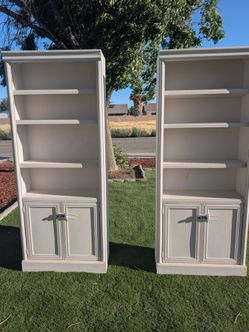 Pair of White Wood Bookcases with Storage Cabinets