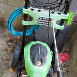 A Greenworks 2100 Psi 1.2 Gpm Pressure Washer And A Ryobi 1800 Psi 1.2 Gpm Pressure Washer 