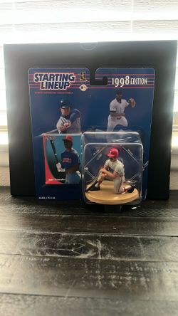 The item is a 1998 Starting Lineup sports collectible featuring Juan Gonzalez of the Texas Rangers. Key details include: 