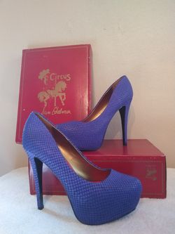 Gorgeous bright purple...snake skin platform heels