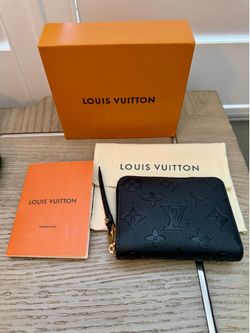 Black wallet with box and everything included in picture