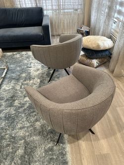 Pair of Modano Midcentury Modern swivel chairs