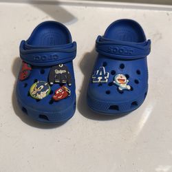 Blue crocs tons of charms size 8c