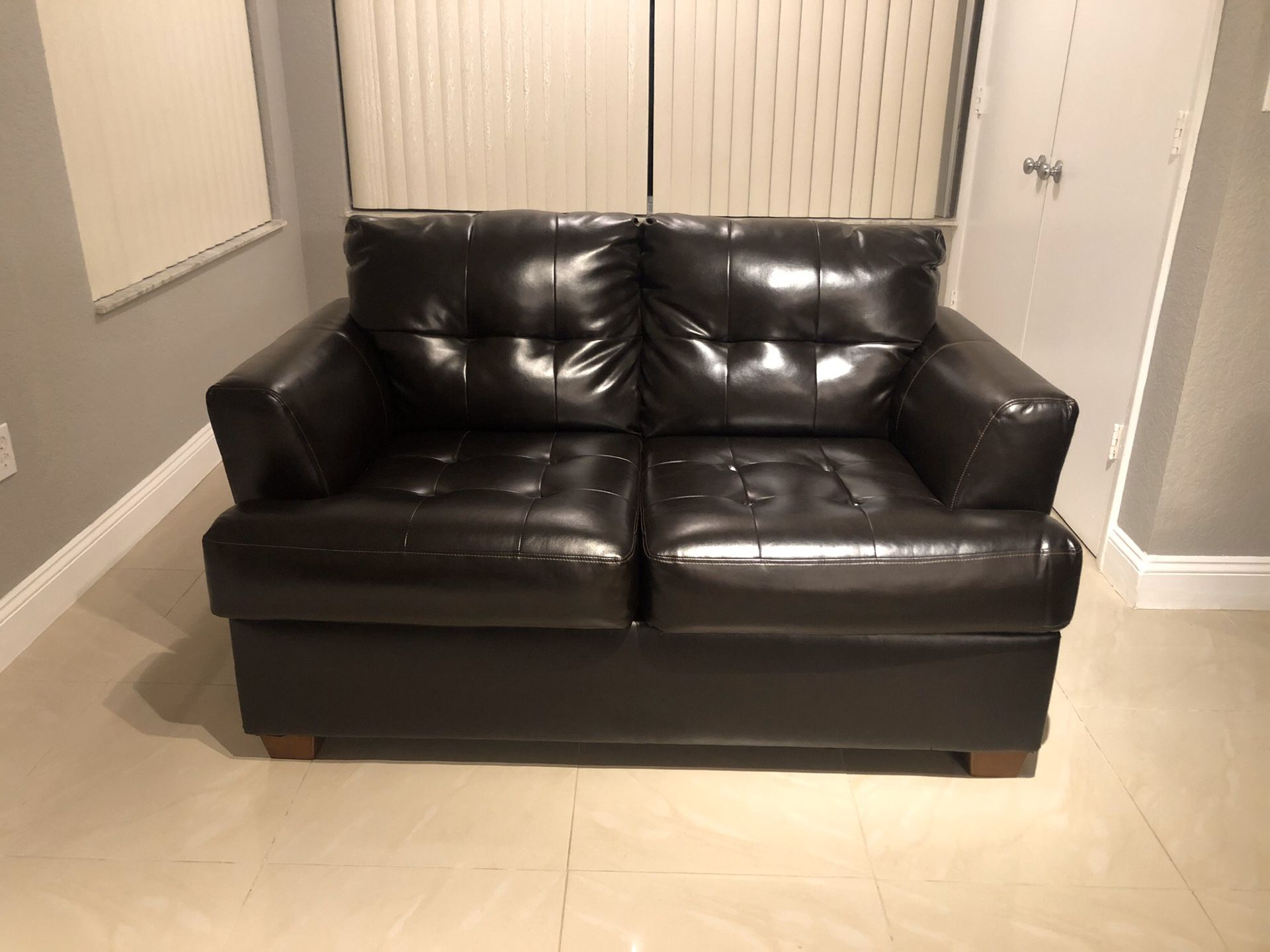 Chocolate brown sofa bed and love seat