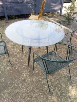 WROUGHT IRON TABLE W/ GLASS TOP & 3 CHAIRS