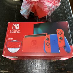 Nintendo Switch, Mario, Red And Blue Edition With Nyxi Pro Controllers.