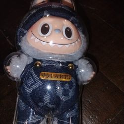 Labubu plush toy wearing a denim outfit 