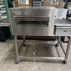 2023 Nat Gas Stack Lincoln 1116 electric Conveyor pizza oven like new on stainless steel mobile stand commercial restaurant bakery food sandwich 18”x5