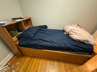 Two mattresses, two bed frames, and a desk
