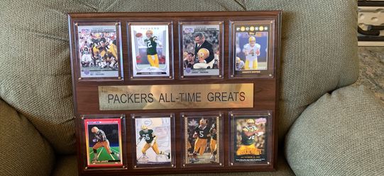 C&I Collectibles Green Bay Packers "All-Time Greats" wooden plaque featuring eight trading cards. The plaque measures 12 inches by 15 inches. It featu