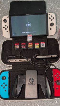 Nintendo switch OLED with six games and accessories