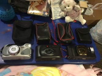3 Old Cameras with four camera carrying cases