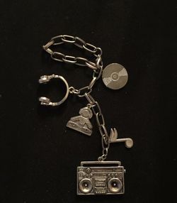 Boombox with music note, headphones and DJ Charm can be used to hang on mirror or used as Keychain.