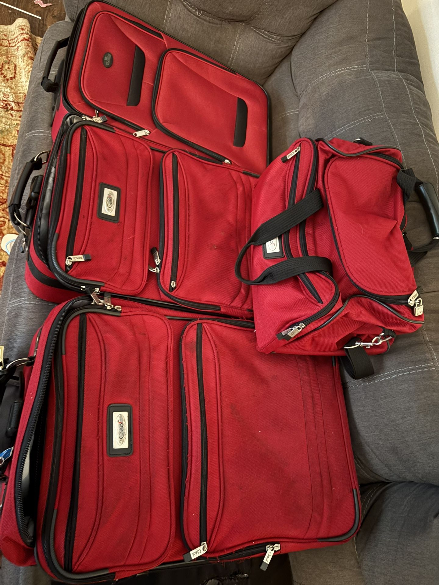 4-piece red softside luggage set by Chaps (a Ralph Lauren diffusion brand)