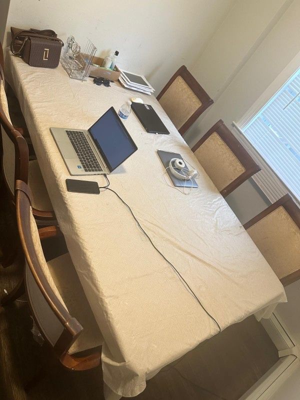 Wooden Dining Table With 6 Chairs. Can be dismantled.