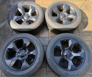 Four 20” Dodge Ram 1500 Wheels + 4 Bridgestone All-Season Tires