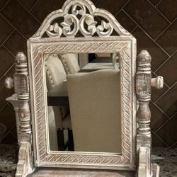 Beautiful wood carved jewelry box mirror with two drawers. Measures 21” tall by 16” wide and 6” deep 