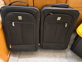 Pair of small carry-on suitcases