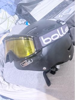 Bollé ski/snowboard helmet with an integrated visor/goggle setup. The rear adjustment dial
