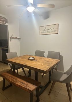 Dining room table with 1 bench and 4 chairs