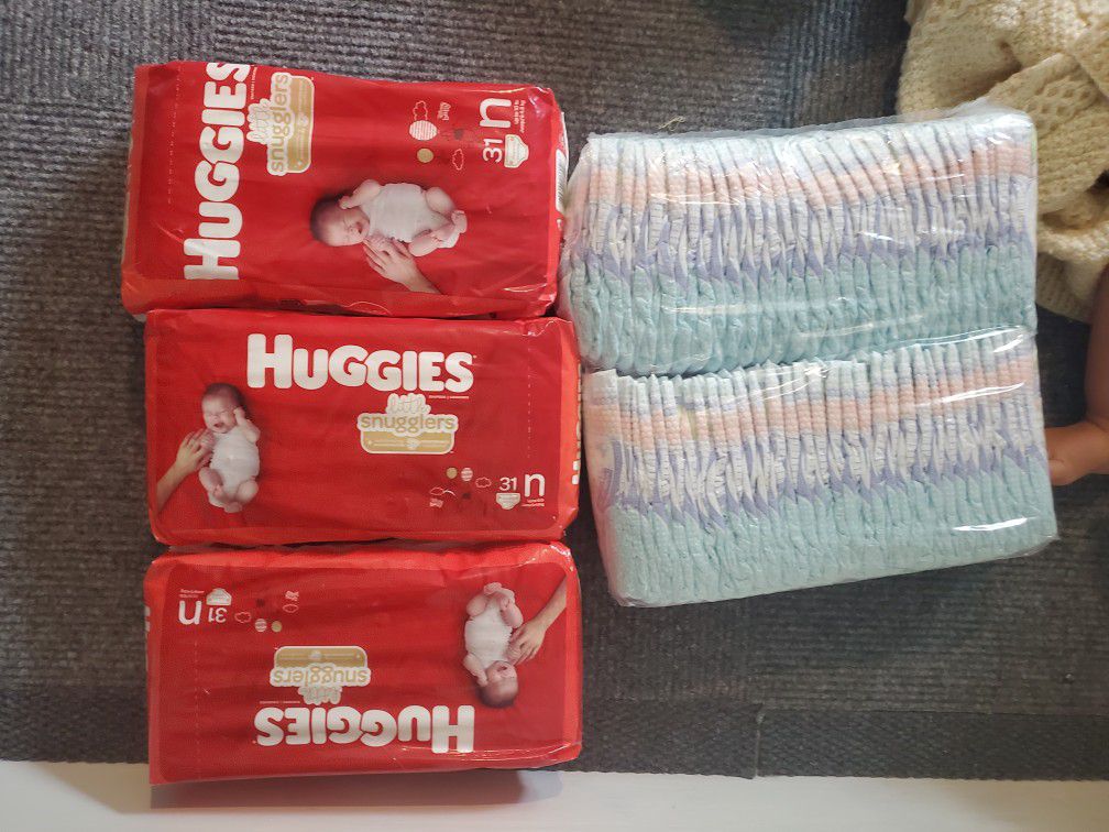 150 newborn diapers NEW NEVER OPENED