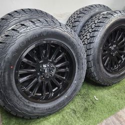 NEW 20 inch gloss black wheels wrapped in 35x12.50R20 tires