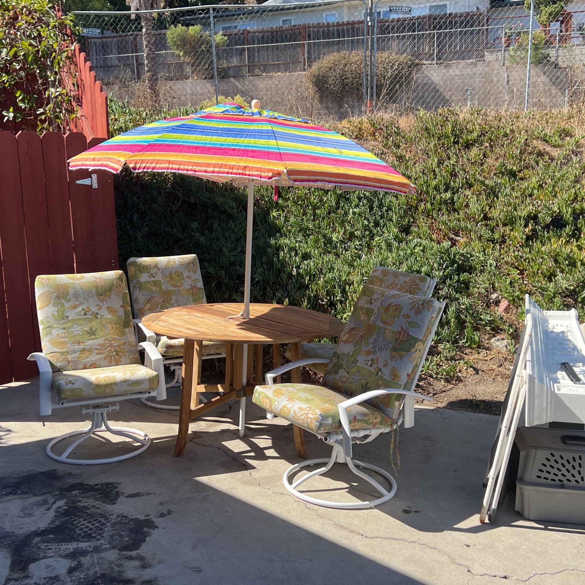 4 Swivel Chairs With Cushions, Teak Wood Foldable Table, Umbrella. for