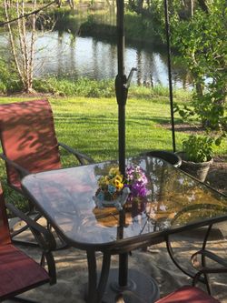 Good Condition Sturdy Patio table with 3 swivel  chairs