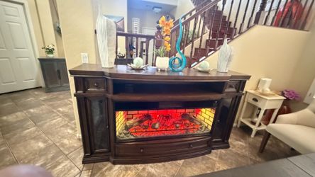 Beautiful and solid fireplace /tv stand in excellent condition 7 colors of flames 75”