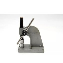 The PanaPress #502 Table Top Arbor Press is a sturdy and durable hand tool made in the USA. It is designed to be used on a workbench and is made of al