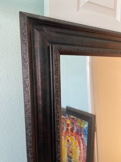 Framed standing mirror