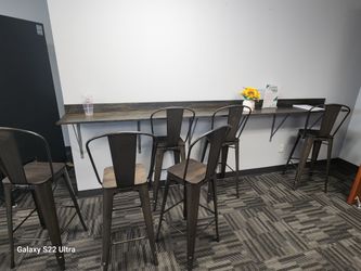 Chairs and table against the wall