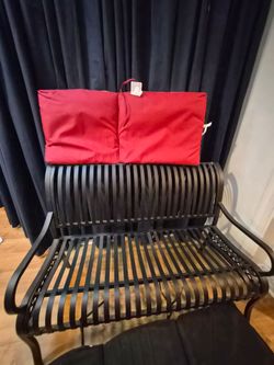 Black Metal Outdoor Bench with Red Cushion