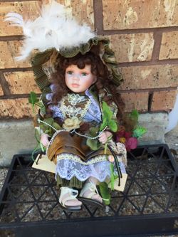 Doll in swing